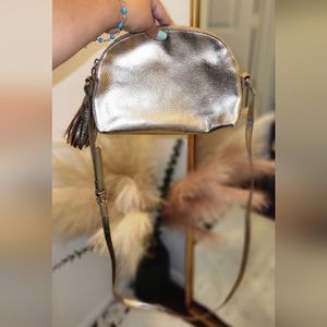 Gold purse with tassle detail